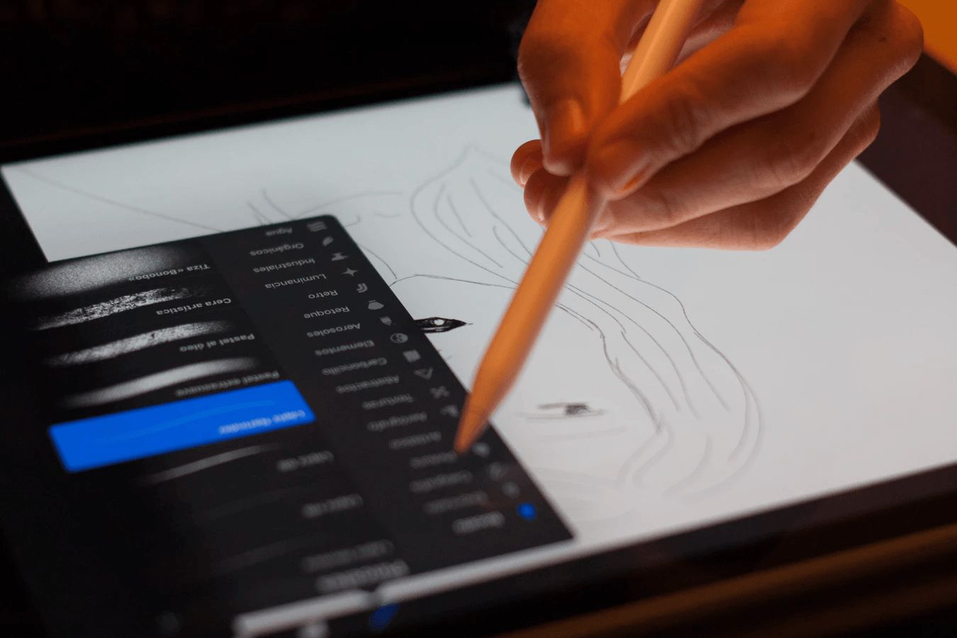 Someone drawing on a tablet.